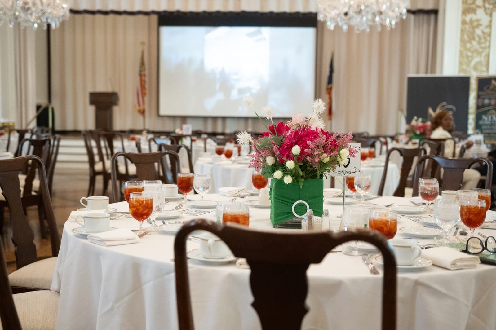 A floral centerpiece on a set table