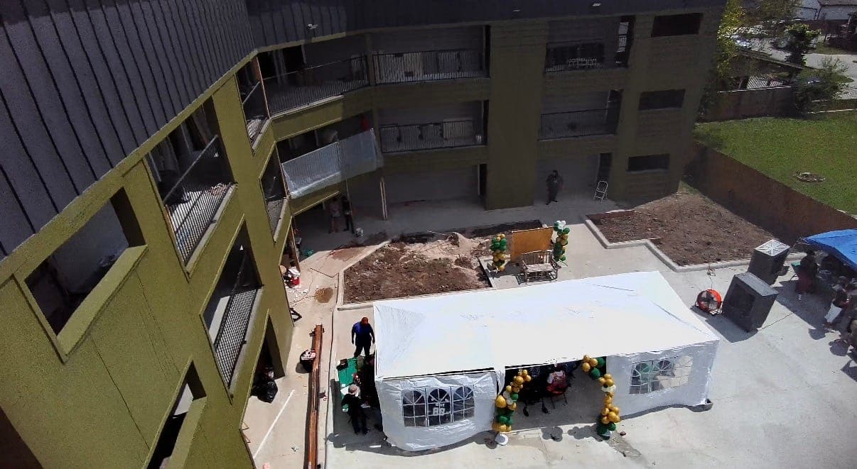 Aerial view of the Nixon Signature Estates building and courtyard event setup