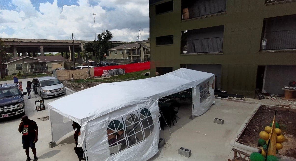 Aerial view of guests walking near the event tents