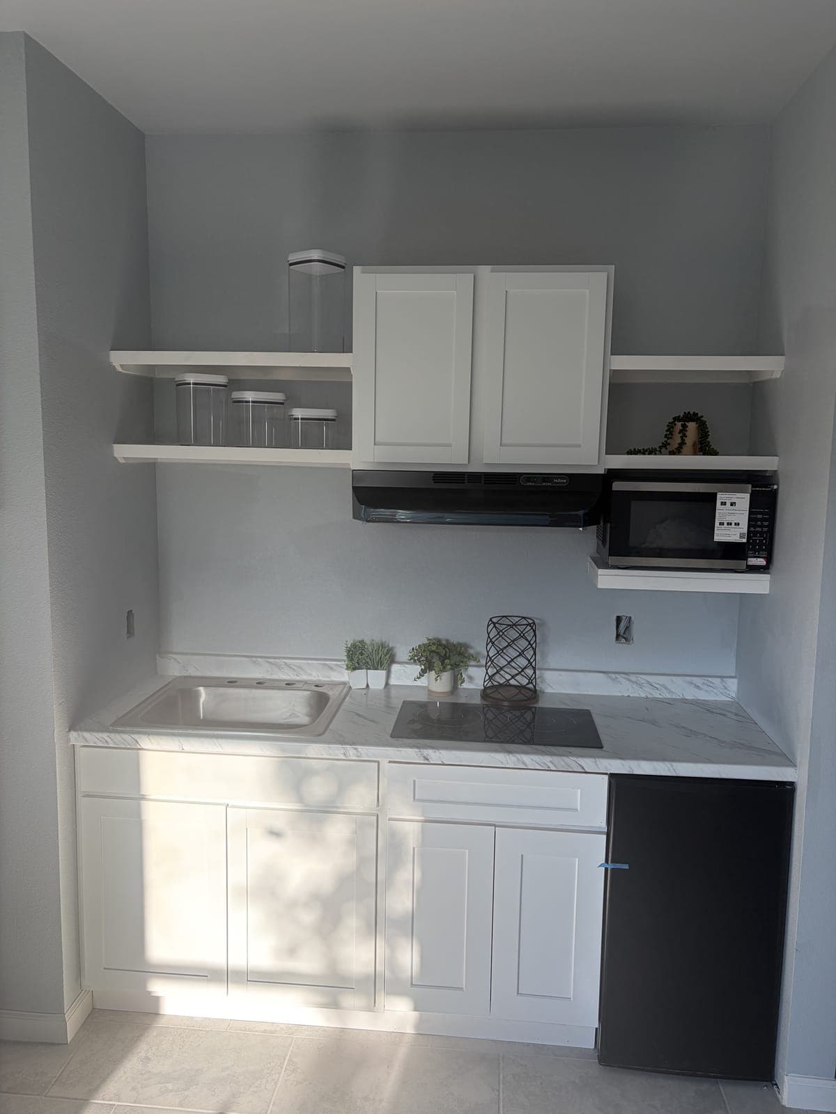 A kitchenette in the furnished demo suite
