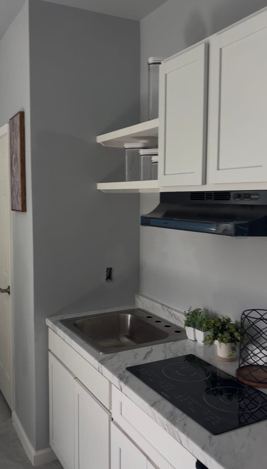 Another view of the kitchenette in the furnished demo suite